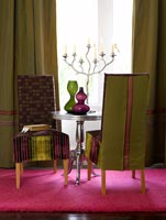Furniture on bright pink rug