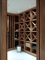 Wooden shelves in modern wine cellar 