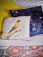 Bird cushion on bed 