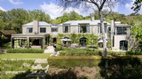 Contemporary home leadinf onto terraced garden