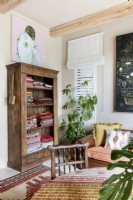 Antique cabinet filled with vintage textiles
