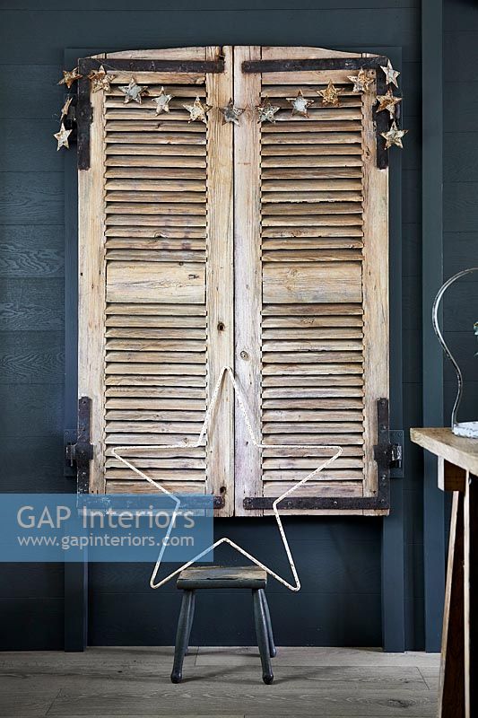 Wooden window shutters decorated with stars