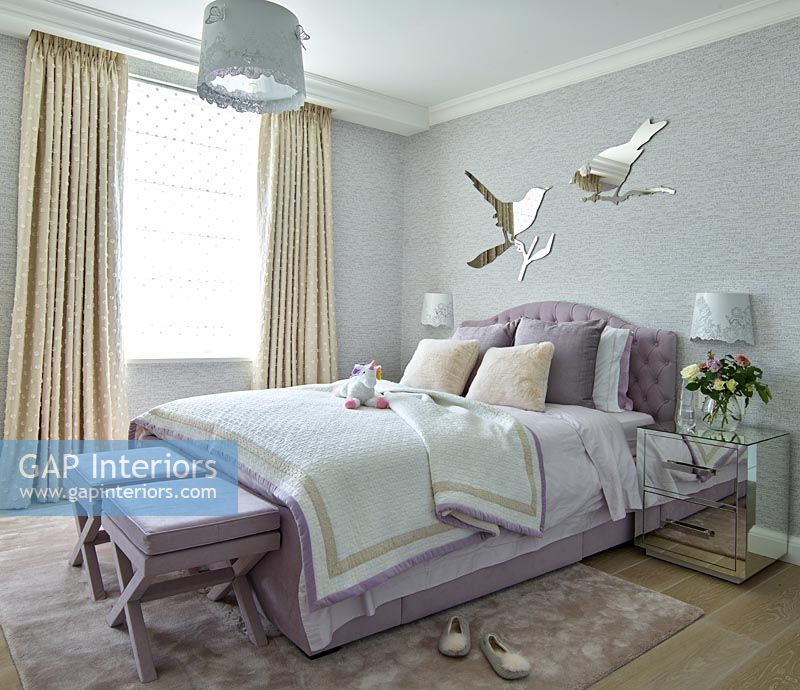 Modern bedroom with bird shaped mirrors