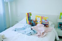 Children reading in bed
