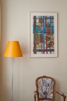 Colourful print and yellow lamp