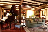 Country living room with grand piano