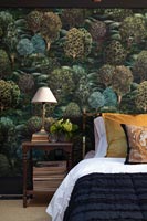 Colourful tree patterned wallpaper in classic bedroom 