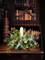 Natural Christmas wreath display with candle 