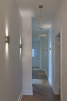 hallway leading to the guest room, guest bathroom and main bedroom 